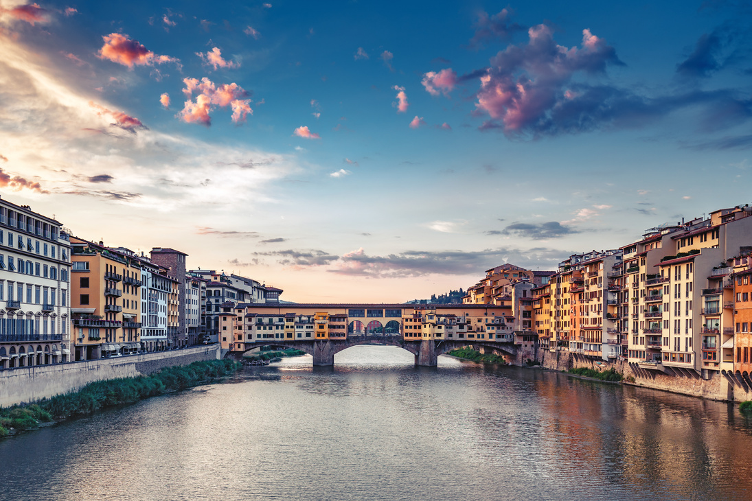 Sunrise over Ponte Vecchio in Florence, Italy, on a summer day.